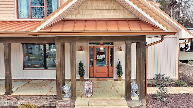 doorway to property featuring covered porch