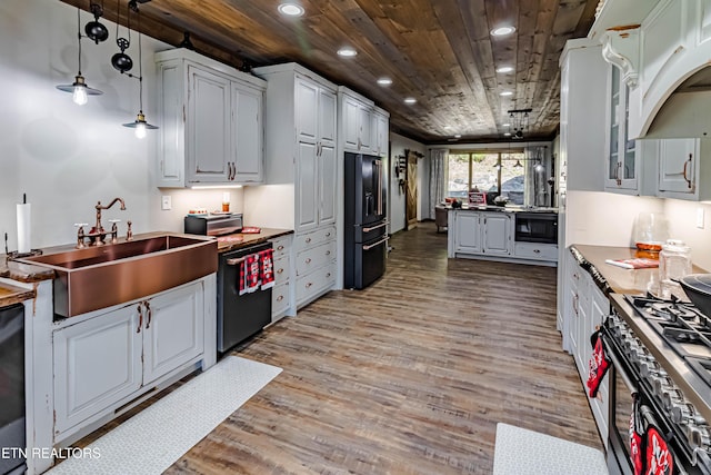 kitchen featuring decorative light fixtures, sink, white cabinets, black appliances, and wooden ceiling