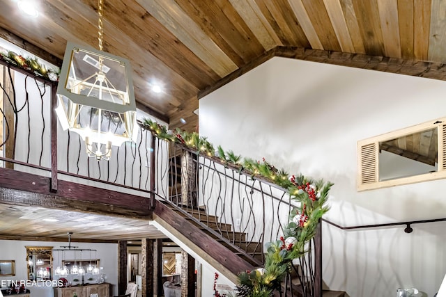 stairway with high vaulted ceiling and wooden ceiling