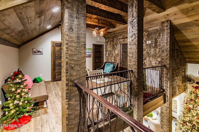 interior space with wood ceiling, wood-type flooring, and vaulted ceiling with beams