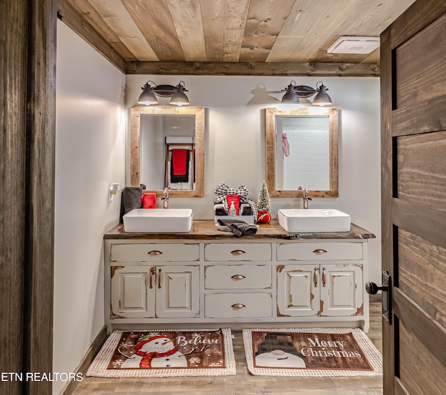 bathroom featuring vanity and wood ceiling