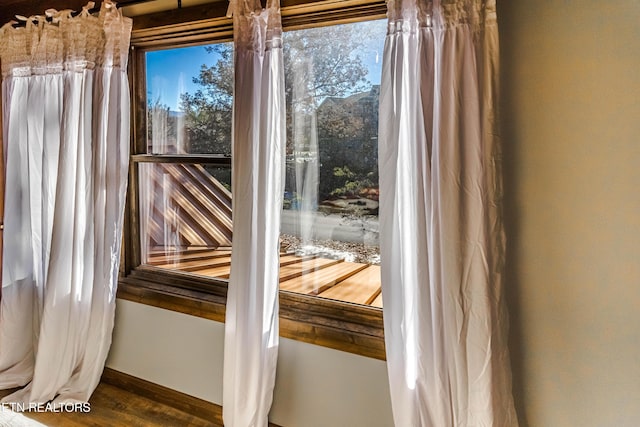 entryway with dark hardwood / wood-style flooring