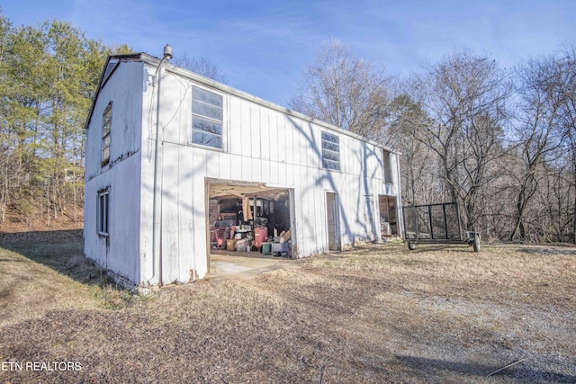 view of home's exterior with an outdoor structure