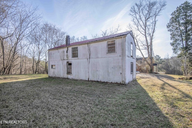 rear view of house with a lawn