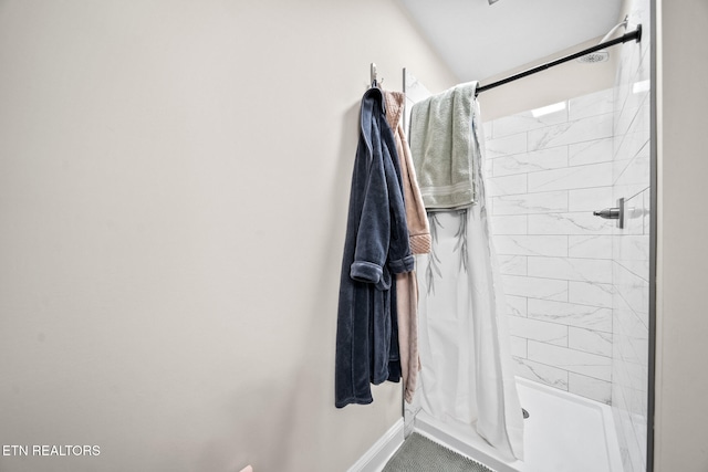 bathroom with a shower with curtain