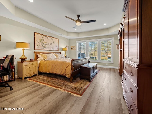 bedroom with ceiling fan and hardwood / wood-style floors