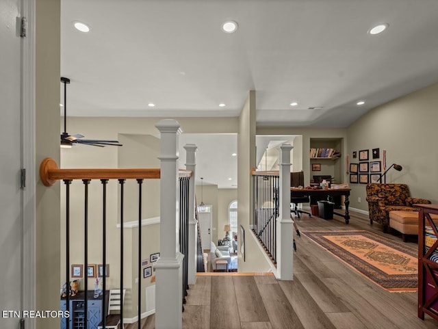 interior space with ornate columns and hardwood / wood-style floors