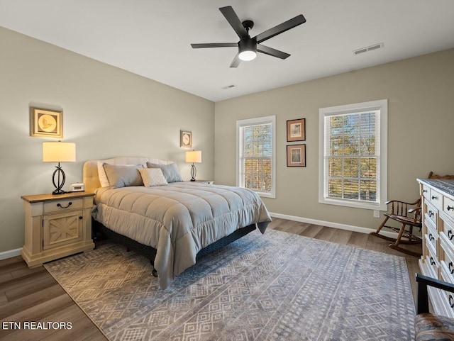 bedroom featuring dark wood-type flooring and ceiling fan