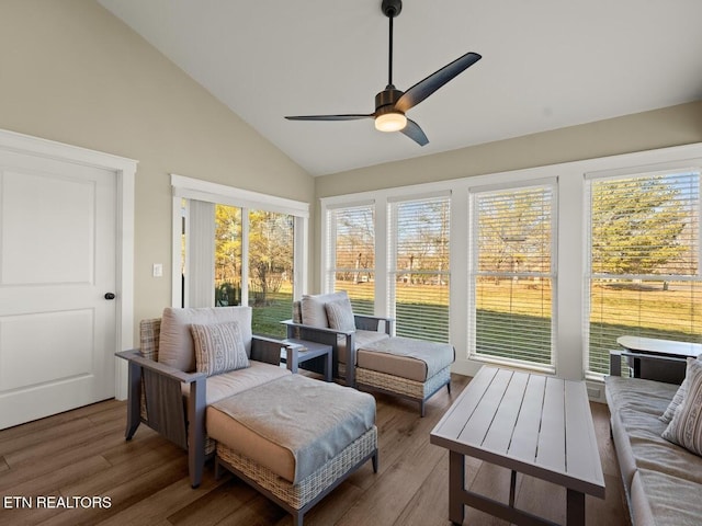 sunroom / solarium with ceiling fan and vaulted ceiling