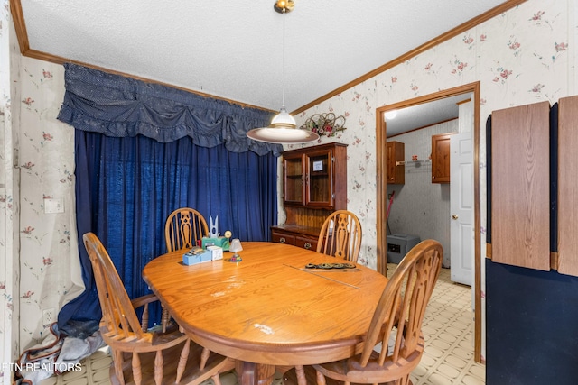 dining area featuring ornamental molding, lofted ceiling, and a textured ceiling