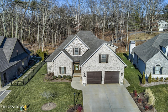 view of front facade featuring a garage and a front lawn