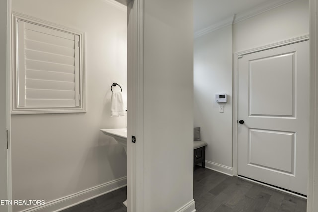 bathroom with crown molding and wood-type flooring