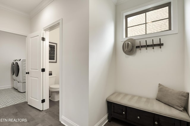 mudroom featuring crown molding, dark hardwood / wood-style floors, and separate washer and dryer