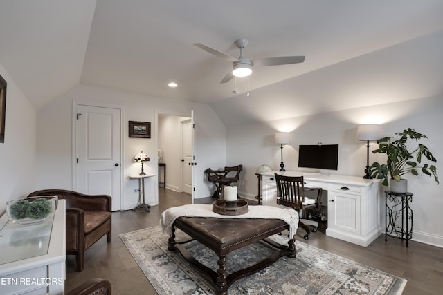 living room featuring vaulted ceiling, dark hardwood / wood-style floors, and ceiling fan