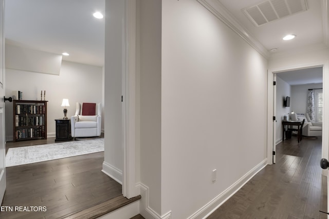 corridor with crown molding and dark hardwood / wood-style floors