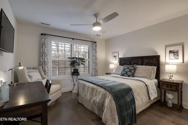 bedroom with ceiling fan and dark hardwood / wood-style flooring