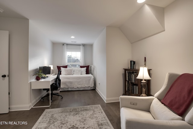 bedroom featuring dark hardwood / wood-style flooring and vaulted ceiling