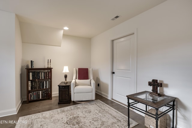 sitting room with dark hardwood / wood-style floors