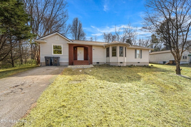 ranch-style home featuring a front yard