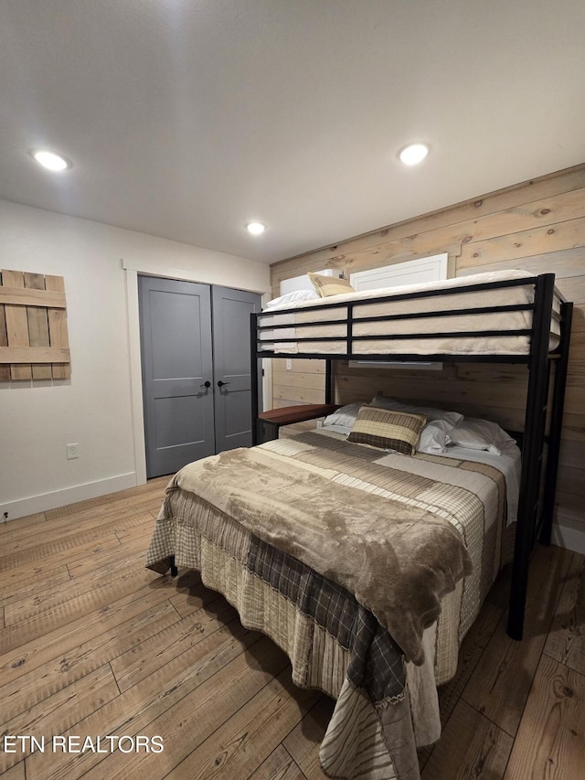 bedroom featuring light hardwood / wood-style floors and a closet