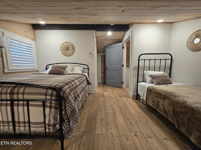 bedroom with wood ceiling and light hardwood / wood-style flooring