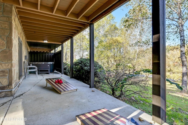 view of patio with a hot tub