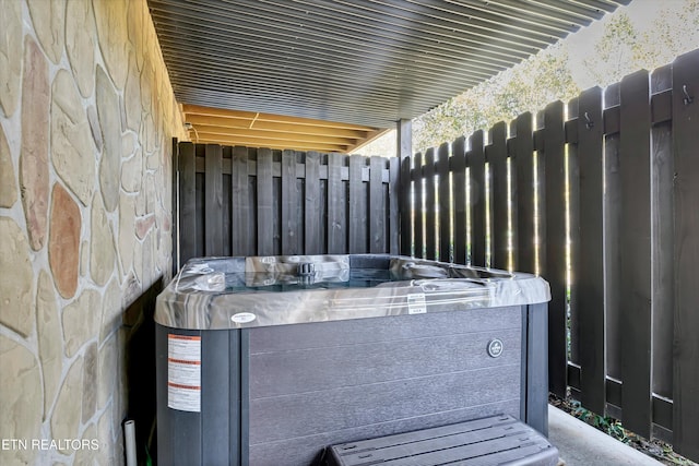 exterior details featuring a hot tub