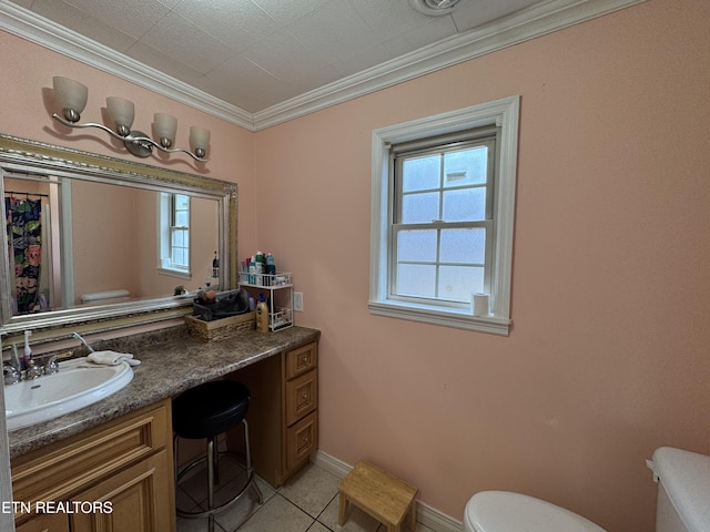 bathroom featuring vanity, crown molding, tile patterned floors, and toilet