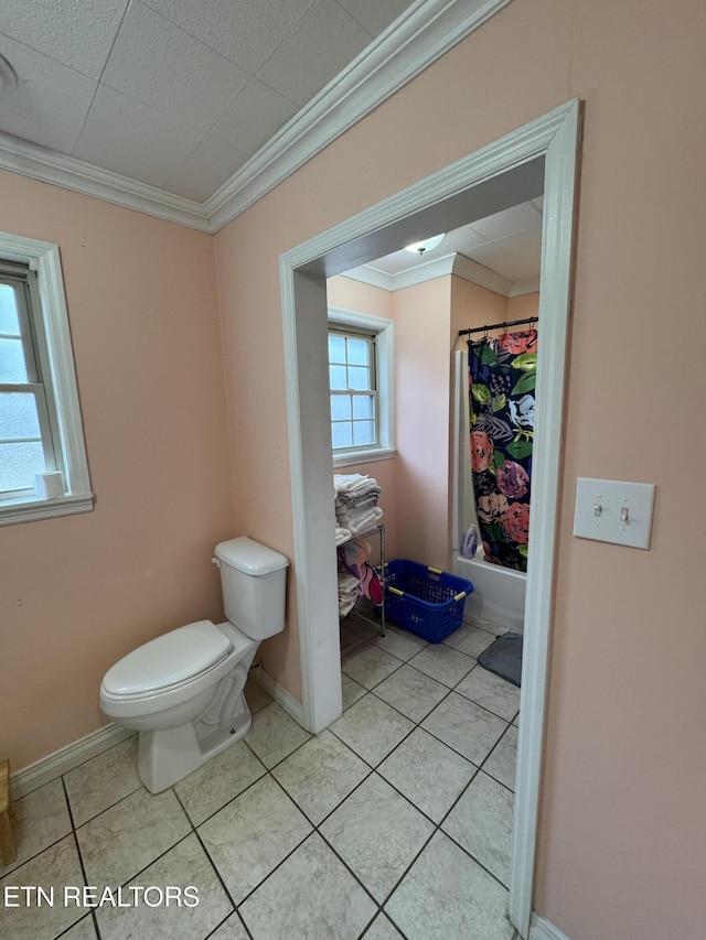 bathroom featuring crown molding, toilet, and tile patterned flooring