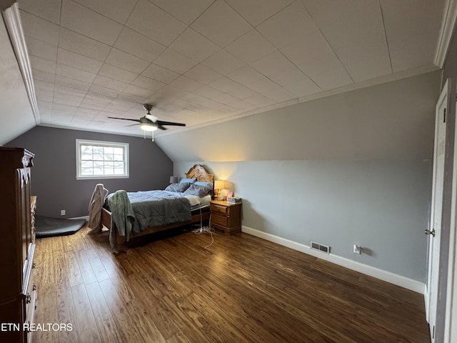 bedroom featuring hardwood / wood-style flooring, vaulted ceiling, and ceiling fan