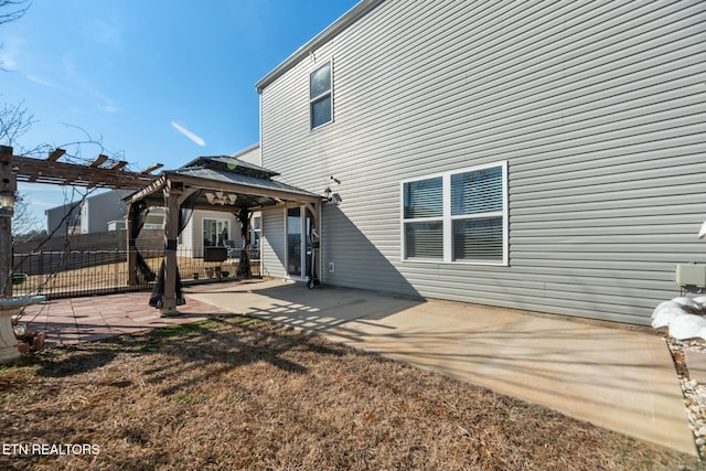 back of house with a pergola, a gazebo, and a patio area