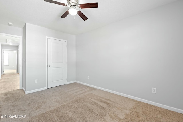 unfurnished bedroom with light carpet and ceiling fan