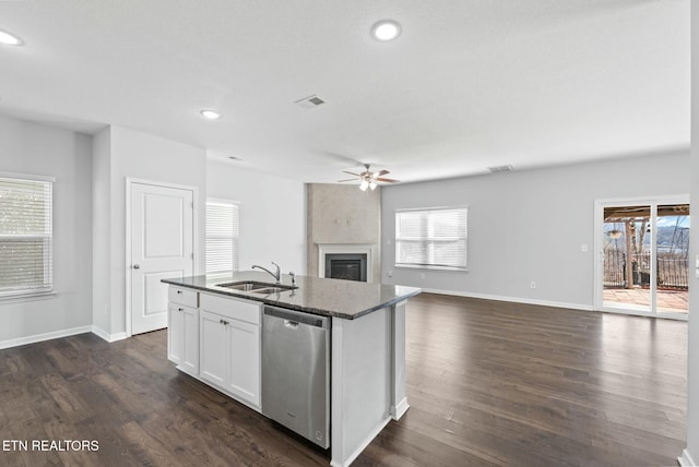 kitchen featuring sink, white cabinetry, dark hardwood / wood-style floors, dishwasher, and an island with sink