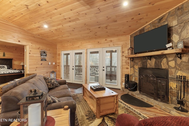 living room featuring french doors, lofted ceiling, wood walls, light hardwood / wood-style flooring, and wooden ceiling