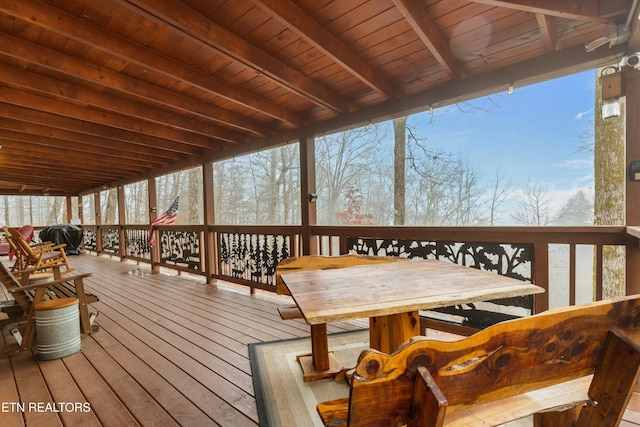 wooden deck with a grill