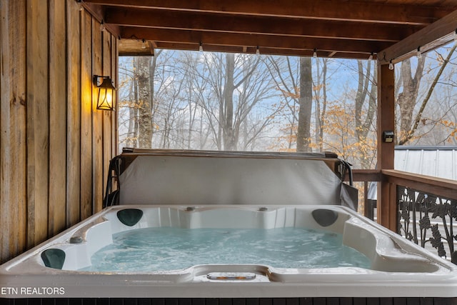 deck featuring a hot tub