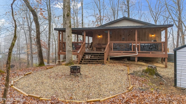 back of property with a deck and central air condition unit