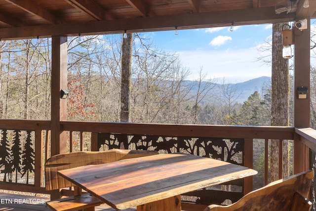 wooden deck featuring a mountain view