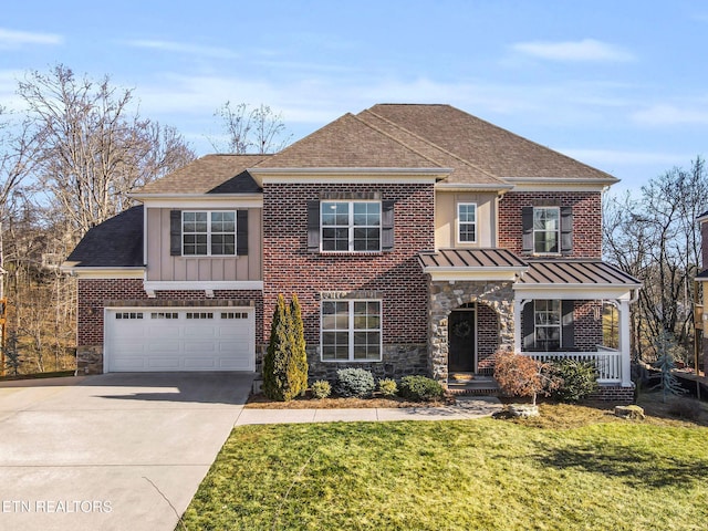 view of front of house featuring a garage, a porch, and a front lawn