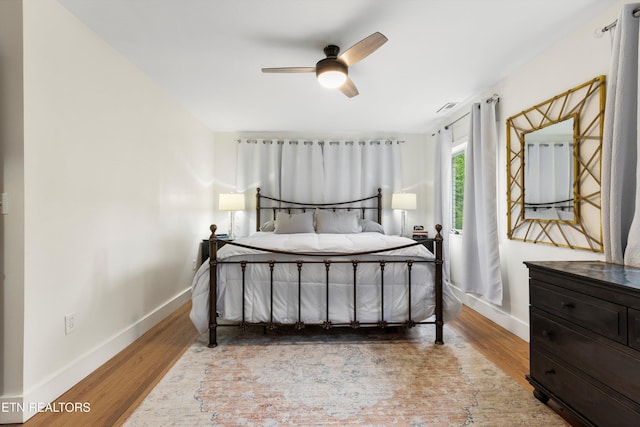 bedroom featuring ceiling fan and hardwood / wood-style floors