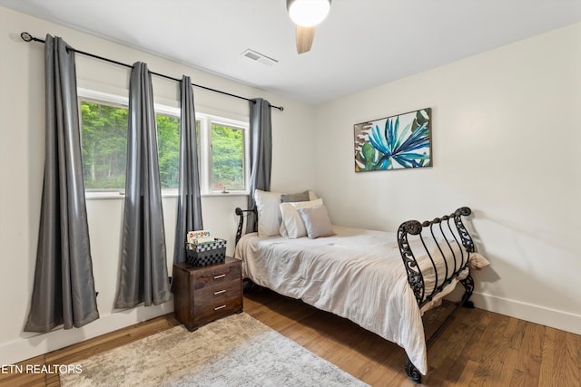 bedroom featuring hardwood / wood-style floors and ceiling fan