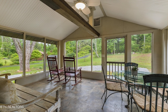 sunroom with ceiling fan and lofted ceiling