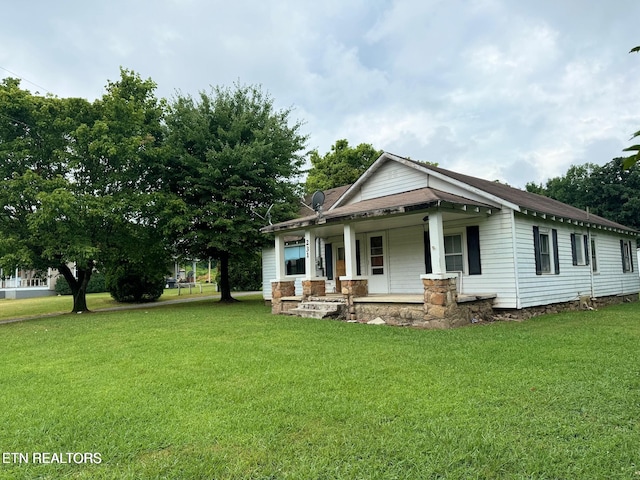 view of front of home featuring a front lawn and a porch