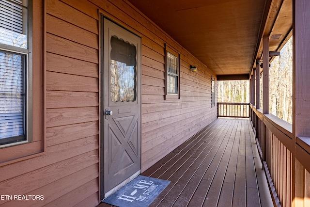 wooden deck featuring covered porch