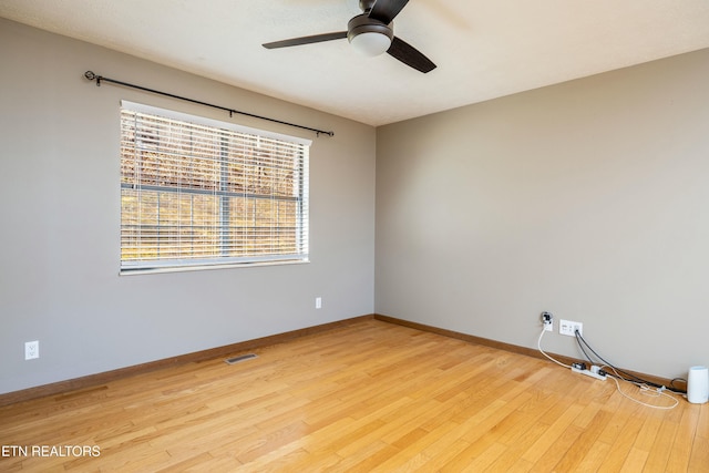 unfurnished room featuring ceiling fan and light hardwood / wood-style flooring