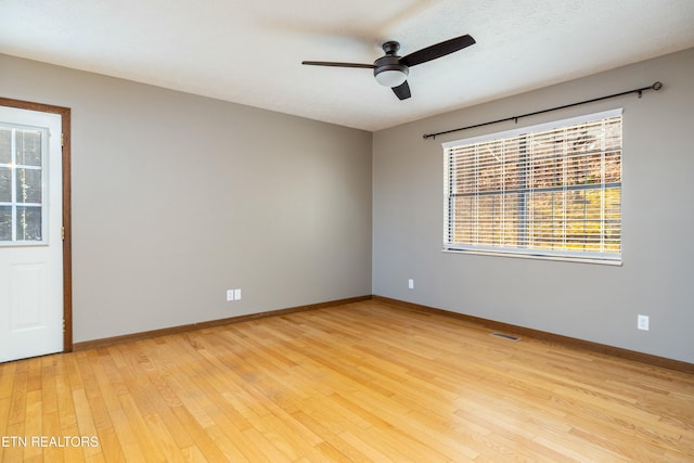 unfurnished room with ceiling fan and light hardwood / wood-style floors