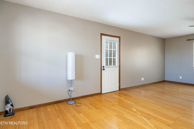 spare room with light wood-type flooring