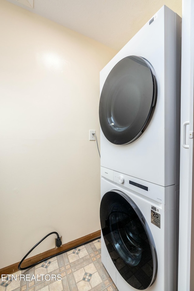 laundry area with stacked washer and clothes dryer