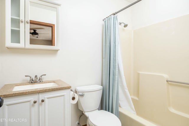 full bathroom with vanity, toilet, and shower / bath combo with shower curtain