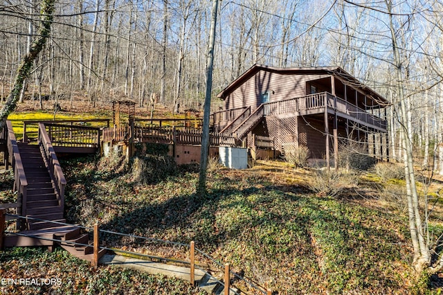 rear view of property with a deck